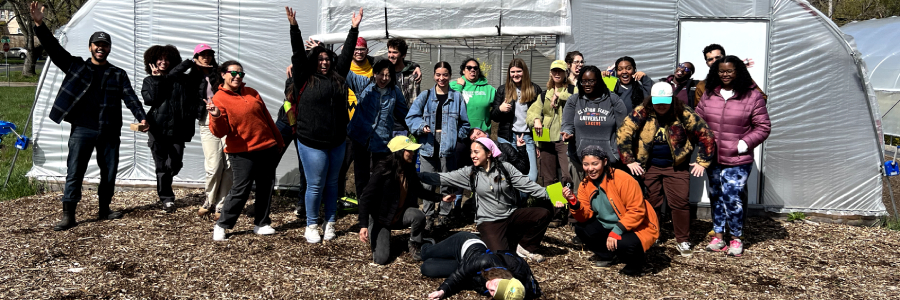 A row of people pose for a SEEDS picture.