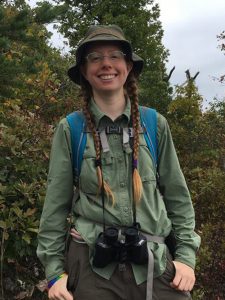 Woman in hat smiling at camera