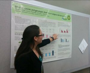 Kendra Chan presenting a poster at a scientific meeting.