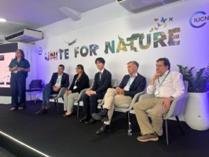 Five experts seated at a panel during the "Invasive Alien Species: Data, Information, and Guidance at the National Level to Support Countries' Action Towards Target 6" session, organized by IUCN at COP16, held in Cali on October 22, 2024.