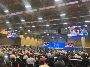 Room hosting the Working Group 2 meeting on Invasive Alien Species negotiation at COP16 in Cali, October 28th, 2024. The room is filled with delegates engaged in discussion, with a focus on the stage where the session is taking place.