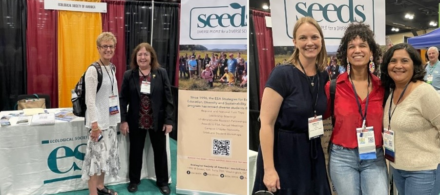 A few people pose in front of a SEEDS banner at the annual meeting.