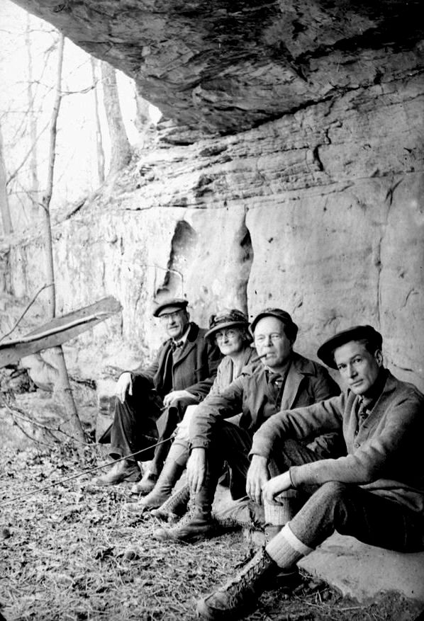 A group of ecologists under in a cavernous overhead.