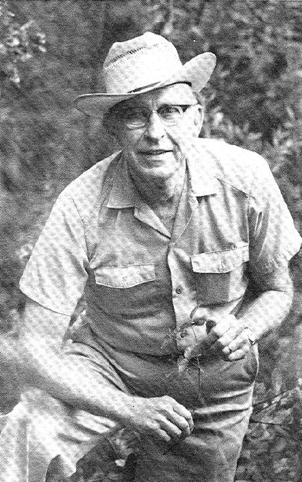 Portrait image of Cornelius Mueller in the field with a fully brimmed hat.