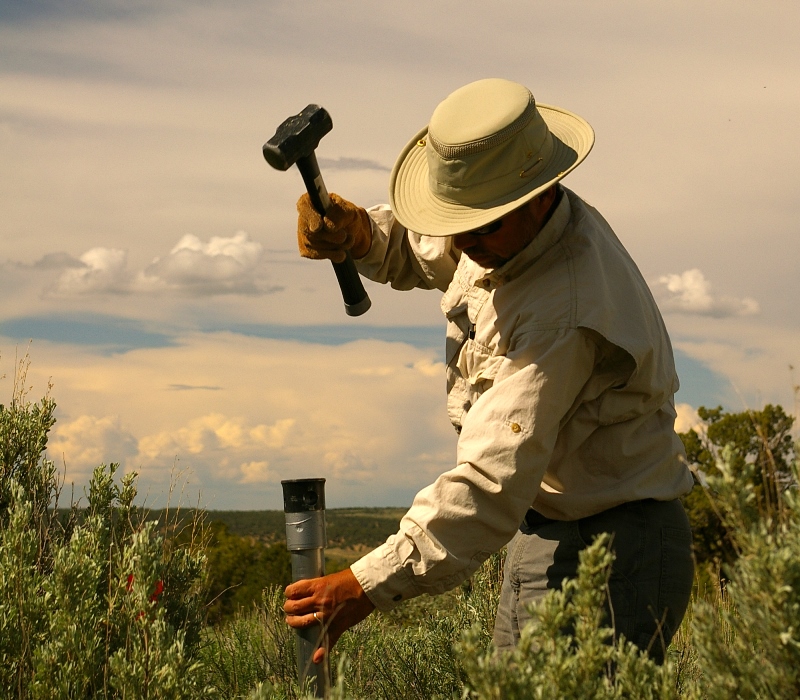 Co-author and Aridlands Natural Resources Consulting Principal Ecologist Richard Alward taking a soil sample. (Photo by Tamera Minnick)